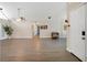 Open living room with gray vinyl plank flooring and neutral walls at 500 Teacup Springs Ct, Winter Garden, FL 34787