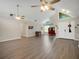 Open concept living area with high ceilings and neutral color palette at 500 Teacup Springs Ct, Winter Garden, FL 34787