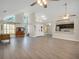 Open concept living room and kitchen with high ceilings and hardwood floors at 500 Teacup Springs Ct, Winter Garden, FL 34787