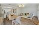 Open concept dining area with light wood table and clear chairs at 1136 Lake Baldwin Ln, Orlando, FL 32814