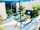 Inviting patio featuring a table, chairs, and umbrella at 10301 Us Highway 27 # 85, Clermont, FL 34711