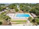 Inviting community pool with lounge chairs and umbrellas at 10301 Us Highway 27 # 85, Clermont, FL 34711