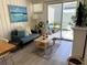 Cozy living room with a sofa and access to a patio at 10301 Us Highway 27 # 85, Clermont, FL 34711