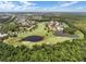 Aerial view of golf course with houses and lakes at 1091 Indigo Dr # 201, Celebration, FL 34747