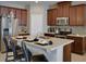 Modern kitchen with stainless steel appliances and an island at 159 Aulin Ave, Oviedo, FL 32765