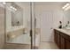 Main bathroom boasts a soaking tub, double vanity, and glass shower at 159 Aulin Ave, Oviedo, FL 32765