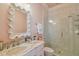 Spa-like bathroom with marble vanity and patterned tile shower at 2228 Azalea Pl, Winter Park, FL 32789