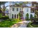 Two story home with lush landscaping and a circular driveway at 2228 Azalea Pl, Winter Park, FL 32789