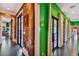 Elegant hallway with ornate wallpaper and French doors leading to other rooms at 2228 Azalea Pl, Winter Park, FL 32789