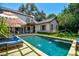 Large backyard with a refreshing pool and patio area at 2228 Azalea Pl, Winter Park, FL 32789