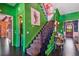 Elegant staircase with leopard-print runner and green walls at 2228 Azalea Pl, Winter Park, FL 32789