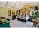 Spacious bedroom with a large canopy bed and patterned wallpaper at 2228 Azalea Pl, Winter Park, FL 32789