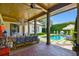 Relaxing covered patio overlooking pool and lush landscaping at 2228 Azalea Pl, Winter Park, FL 32789