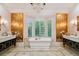 Luxurious bathroom with a freestanding tub and marble finishes at 2228 Azalea Pl, Winter Park, FL 32789