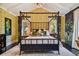 Serene bedroom with a four-poster bed and soft color scheme at 2228 Azalea Pl, Winter Park, FL 32789