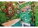 Chic powder room boasts a statement sink and banana leaf wallpaper at 2228 Azalea Pl, Winter Park, FL 32789