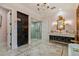 Primary bathroom with a walk-in shower and double vanity at 2228 Azalea Pl, Winter Park, FL 32789