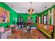 Green living room with eclectic decor and access to the backyard at 2228 Azalea Pl, Winter Park, FL 32789