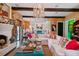 Open living room with a large sectional sofa and exposed beams at 2228 Azalea Pl, Winter Park, FL 32789