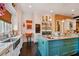 Modern kitchen with stainless steel appliances and a large island at 2228 Azalea Pl, Winter Park, FL 32789