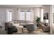 Relaxing living room with L-shaped sectional and stylish decor at 155 Aulin Ave, Oviedo, FL 32765