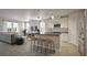 Modern open-concept kitchen with island and breakfast bar at 155 Aulin Ave, Oviedo, FL 32765