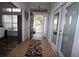 Bright and airy entryway with tile flooring and access to a screened porch at 1545 Blue Sky Blvd, Haines City, FL 33844