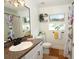 Clean bathroom featuring a vanity, toilet, and shower/tub at 1545 Blue Sky Blvd, Haines City, FL 33844