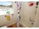 Bright bathroom with shower/tub combo, window, and updated vanity at 1545 Blue Sky Blvd, Haines City, FL 33844