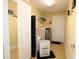 Laundry room with washer, dryer, and storage at 1545 Blue Sky Blvd, Haines City, FL 33844