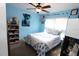 Light blue bedroom with a double bed, ceiling fan and plenty of storage at 1545 Blue Sky Blvd, Haines City, FL 33844