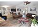 Spacious living room with hardwood floors and a view of the kitchen at 1545 Blue Sky Blvd, Haines City, FL 33844