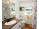 Clean bathroom featuring a vanity, toilet, and shower/tub at 1545 Blue Sky Blvd, Haines City, FL 33844