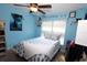 Light blue bedroom with a double bed, ceiling fan and plenty of storage at 1545 Blue Sky Blvd, Haines City, FL 33844