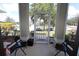 Inviting screened porch with two folding chairs, offering a relaxing outdoor space at 1545 Blue Sky Blvd, Haines City, FL 33844