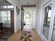 Bright and spacious entryway with tile flooring and access to screened porch at 1545 Blue Sky Blvd, Haines City, FL 33844