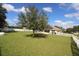 Large backyard with solar panels and a hammock at 1545 Blue Sky Blvd, Haines City, FL 33844
