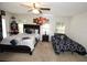Spacious Primary bedroom with a king-size bed and twin bed at 1545 Blue Sky Blvd, Haines City, FL 33844