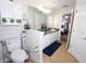 Bathroom with double vanity, and a view into the bedroom at 1545 Blue Sky Blvd, Haines City, FL 33844