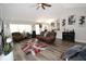 Living room with hardwood floors and comfortable seating at 1545 Blue Sky Blvd, Haines City, FL 33844