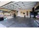 Spacious two-car garage with built-in shelving and ample storage space at 1545 Blue Sky Blvd, Haines City, FL 33844