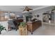 Living area with leather sofas, a large TV and access to backyard at 632 Country Club Dr, Winter Park, FL 32789
