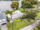 Bird's-eye view of the house and surrounding area, showcasing a large backyard and lake access at 632 Country Club Dr, Winter Park, FL 32789