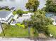 Aerial view showing home's location, landscaping, and water access at 632 Country Club Dr, Winter Park, FL 32789