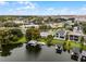 Wide aerial view of a waterfront home with a large backyard and boat dock at 632 Country Club Dr, Winter Park, FL 32789