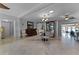 Dining room with a round table and chairs, and a sliding barn door at 632 Country Club Dr, Winter Park, FL 32789