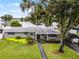 Charming ranch home with landscaped yard, offering curb appeal and lake views at 632 Country Club Dr, Winter Park, FL 32789