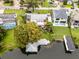 Aerial view of a waterfront home with a large backyard and boat dock at 632 Country Club Dr, Winter Park, FL 32789