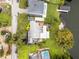 Aerial view of the house and surrounding area, showcasing the large backyard and lake access at 632 Country Club Dr, Winter Park, FL 32789