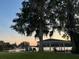 Tranquil waterfront view with gazebo, ideal for relaxation and entertainment at 632 Country Club Dr, Winter Park, FL 32789